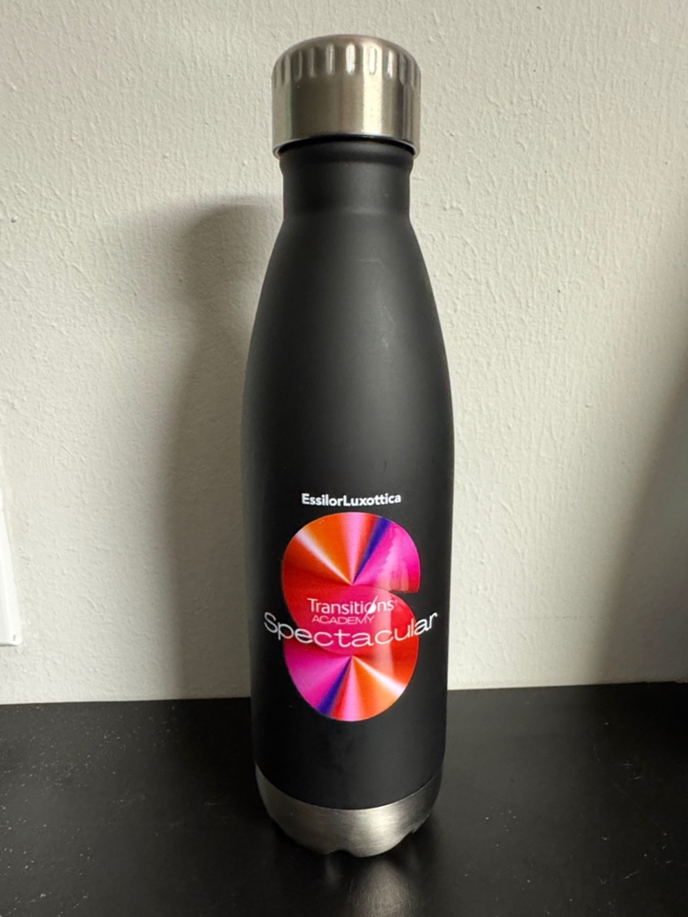EssilorLuxottica Transitions Spectacular Black Stainless Bottle